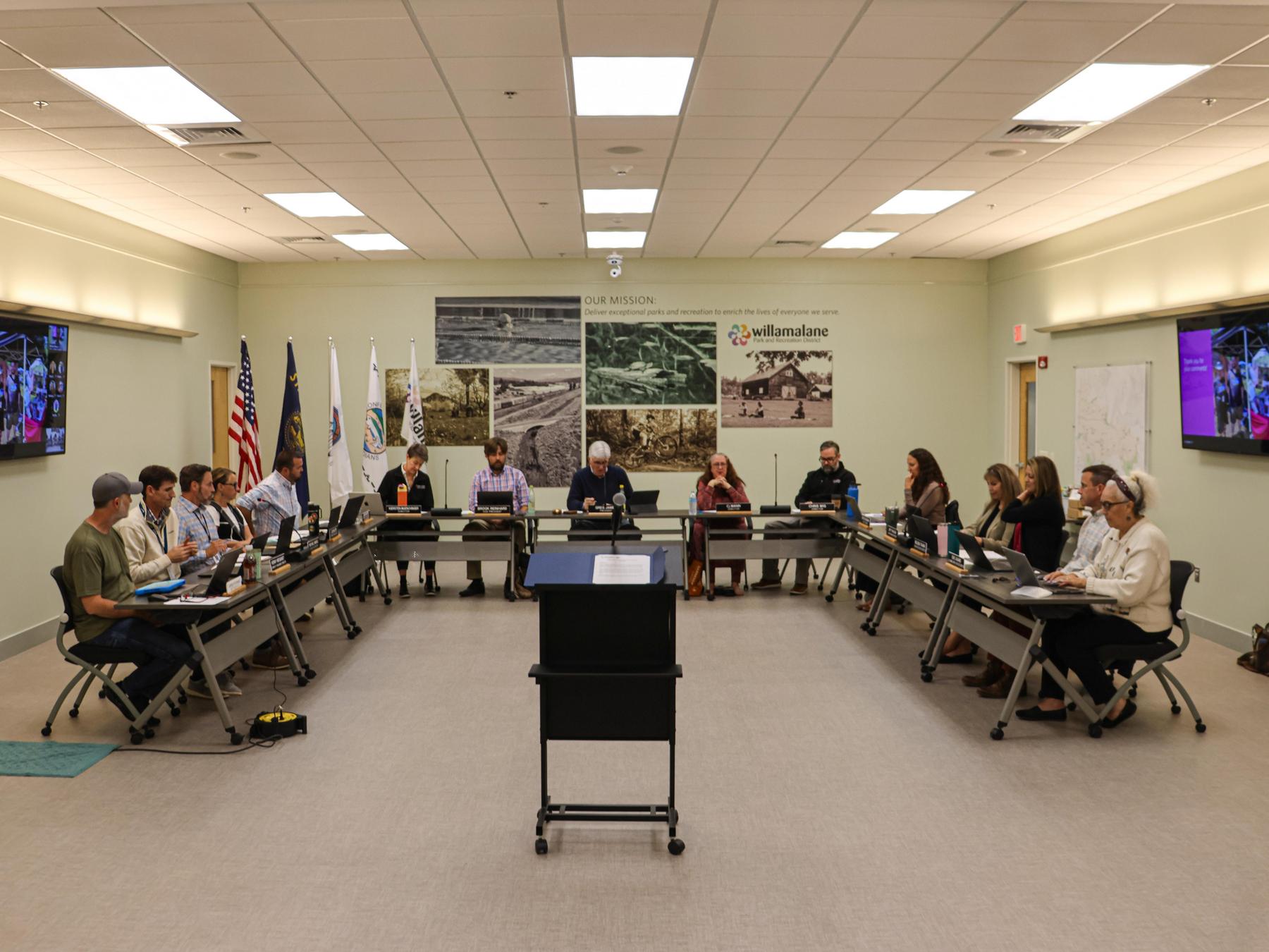 A podium sits facing the Willamalane board of directors and relevant staff