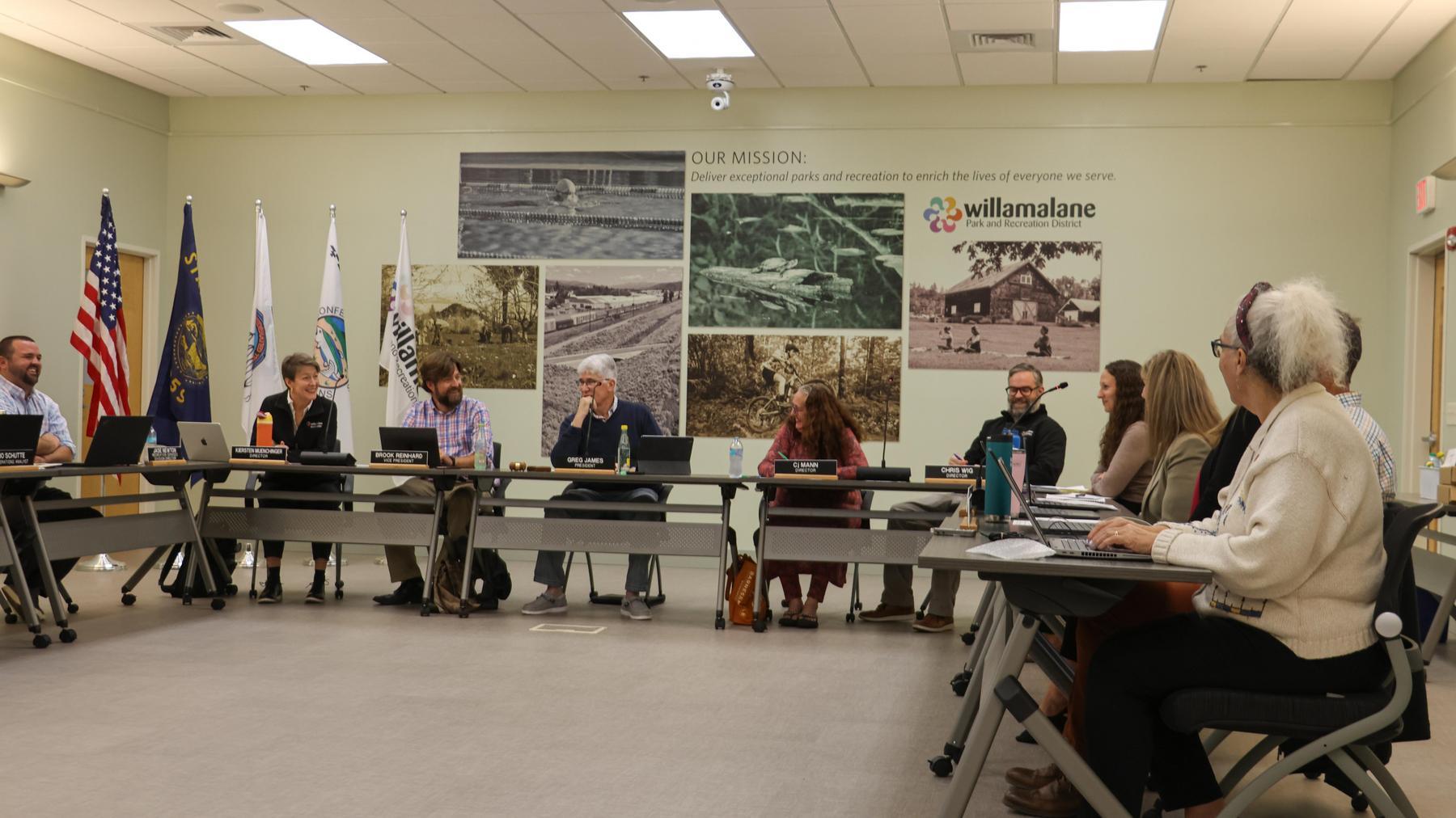 Willamalane board of directors sit at tables during a board meeting