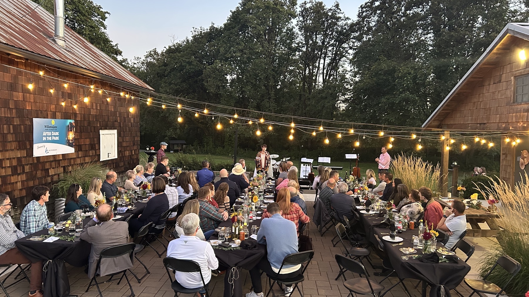 people enjoy dinner outside at Dorris Ranch event