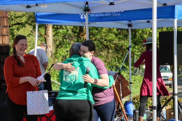Nancy hugs Tracy, Willamalane's events coordinator.