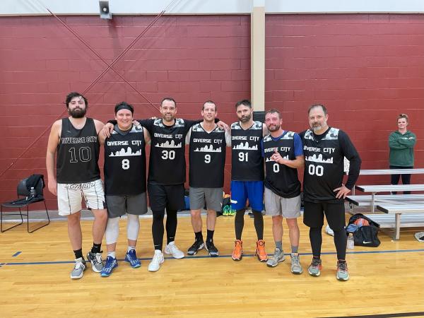 seven men on the basketball court