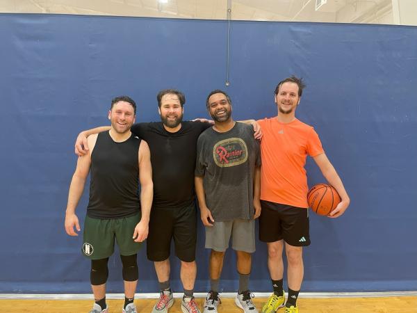 four men on the basketball court