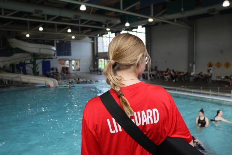 Lifeguard stands in front of pool