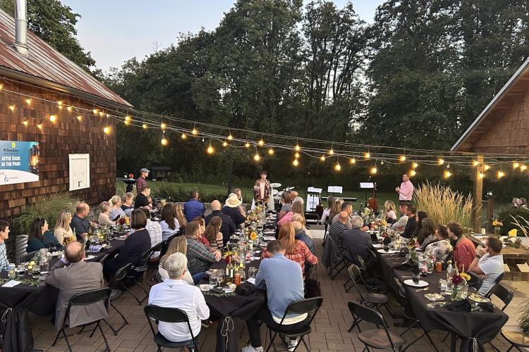 people enjoy dinner outside at Dorris Ranch event