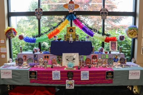 A colorful ofrenda with offerings to loved ones who passed.