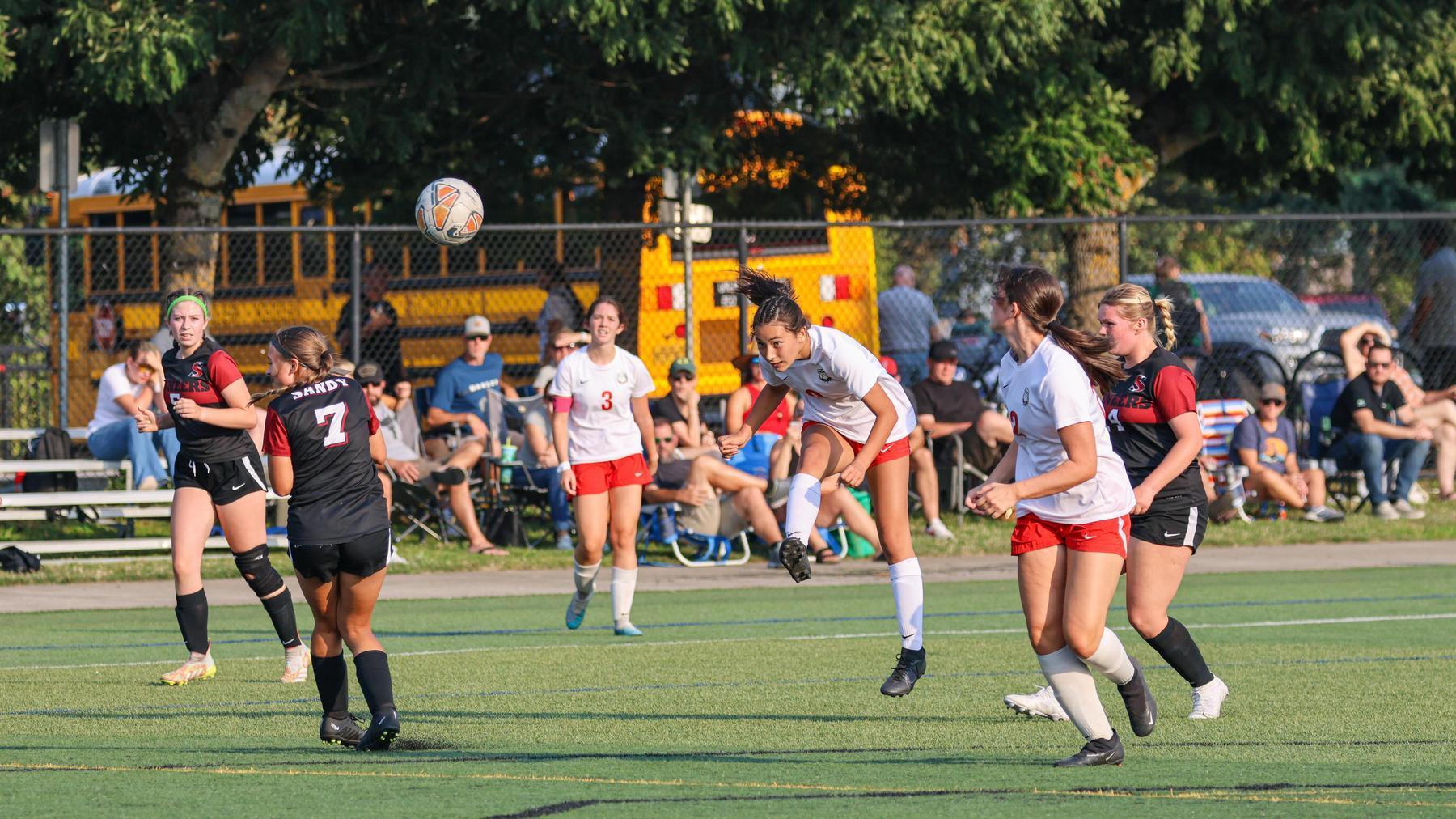 Girls play soccer in high school tournament