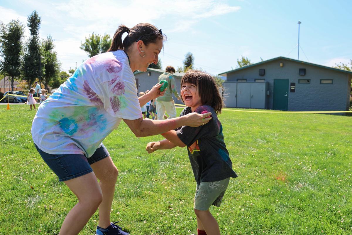 Adult and child smiling