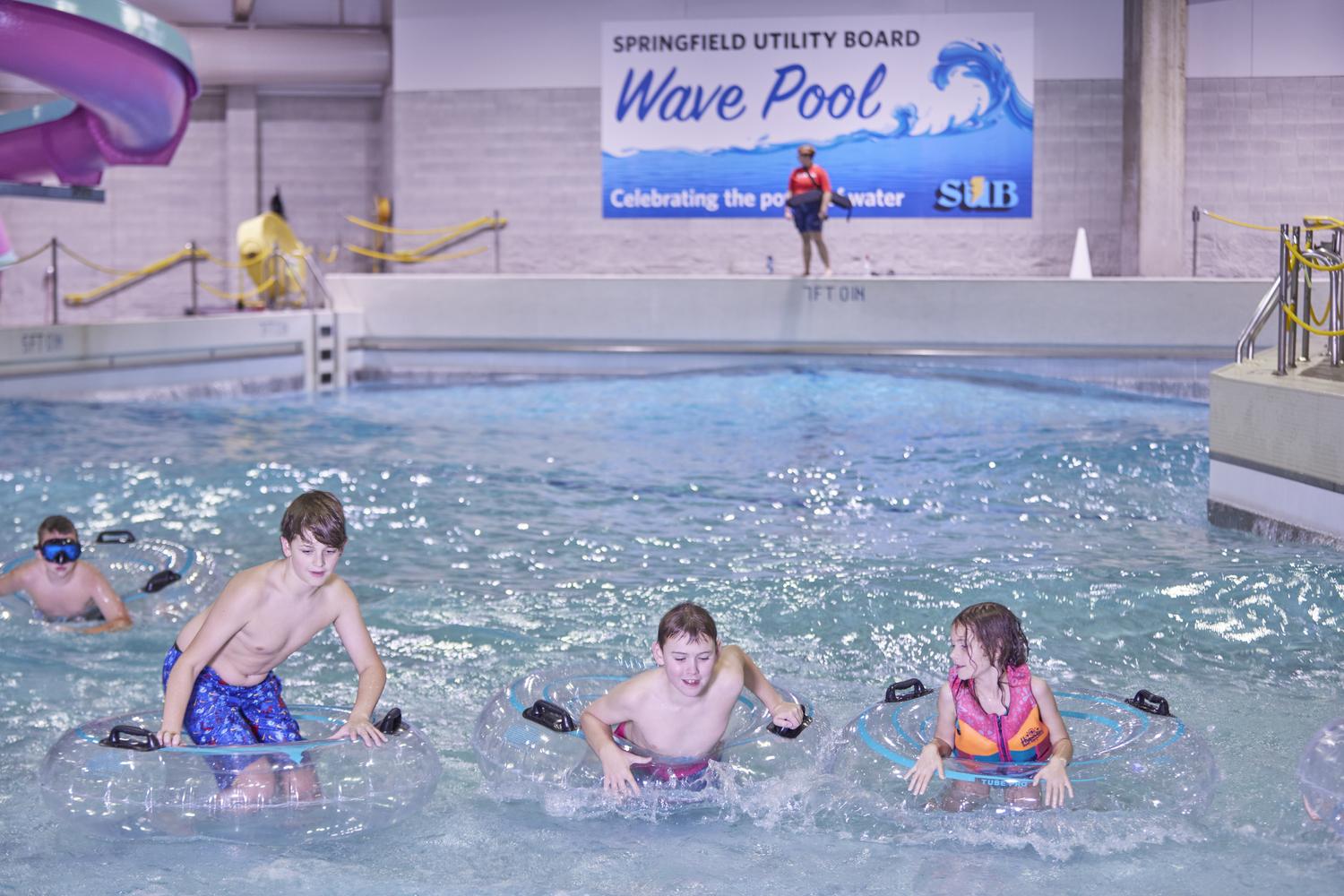 Kids use intertubes in the SUB Wave Pool at Splash