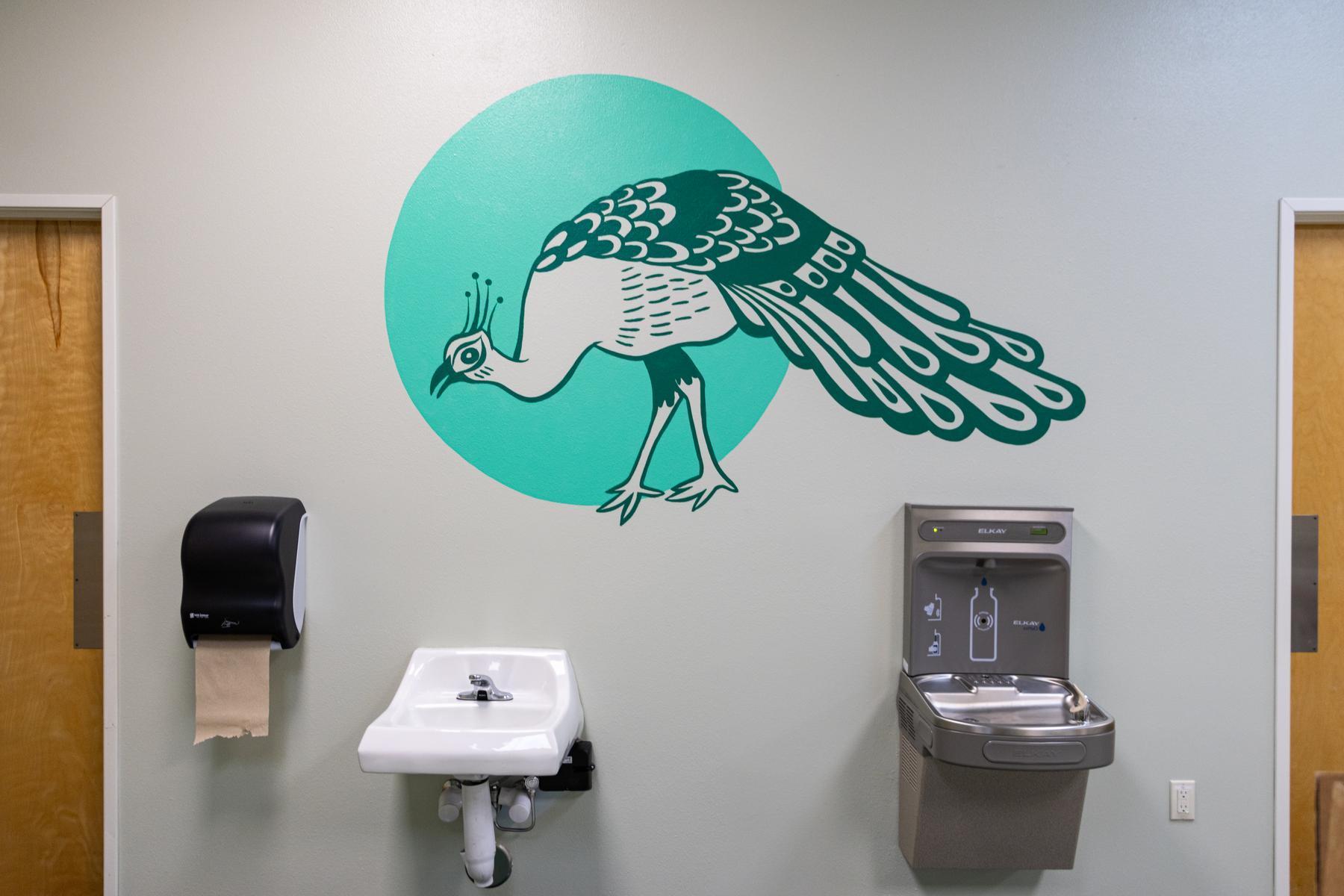 Mural of peacock on preschool walls