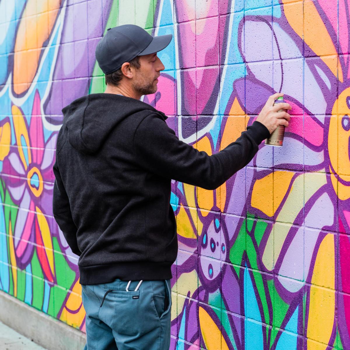 Bayne Gardner spray paints mural