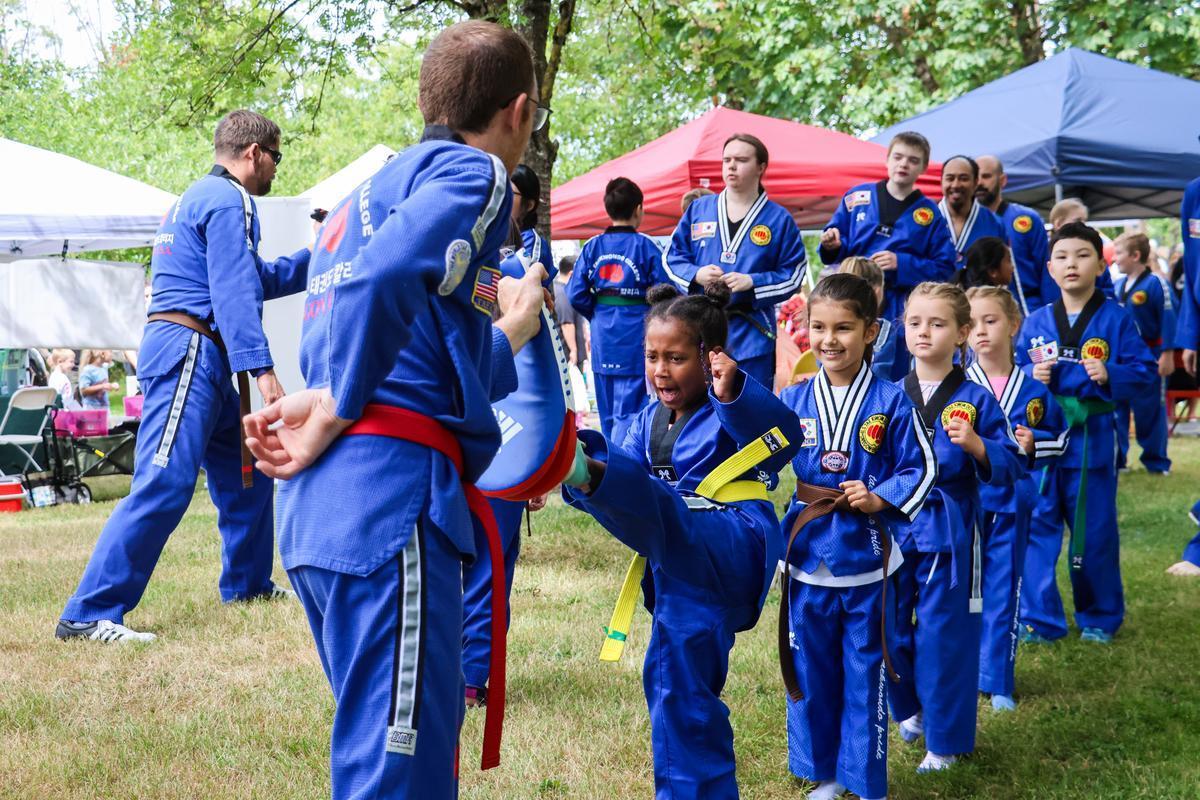 Children participate in martial arts demonstration at Children's Celebration