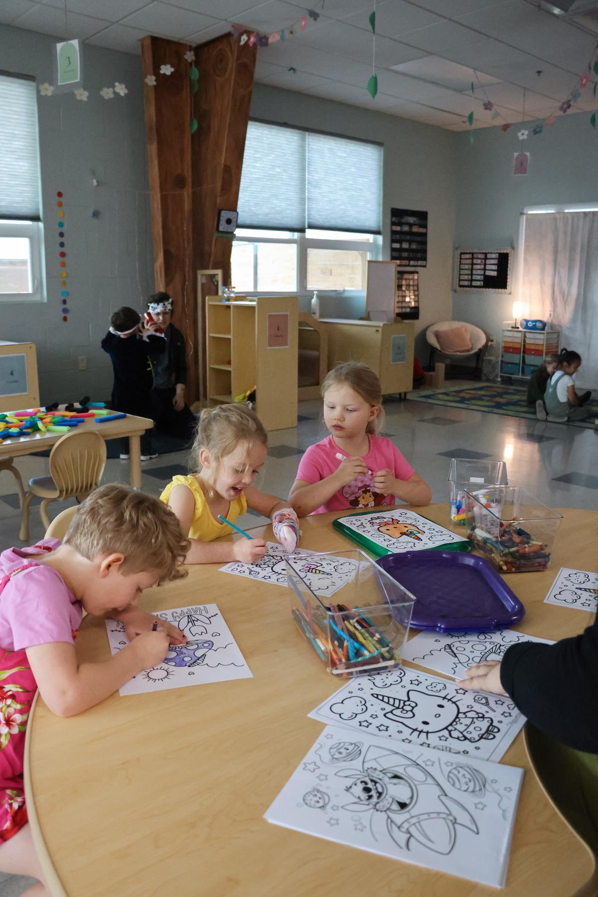 Preschoolers color indoors