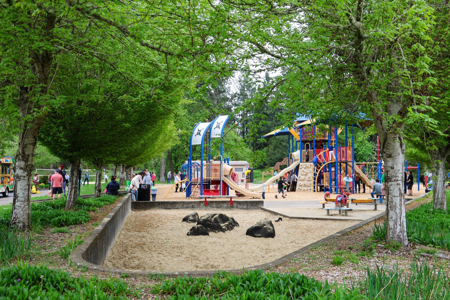 A sand play area sits next to play structures