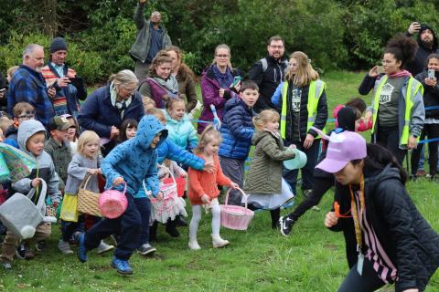 Children run from starting line to hunt eggs at MEGGA Hunt