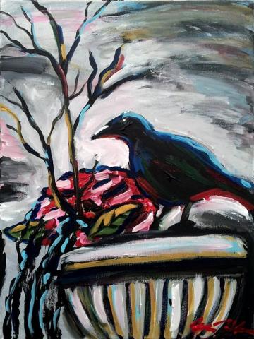 A painted crow sits on a decorative pot.